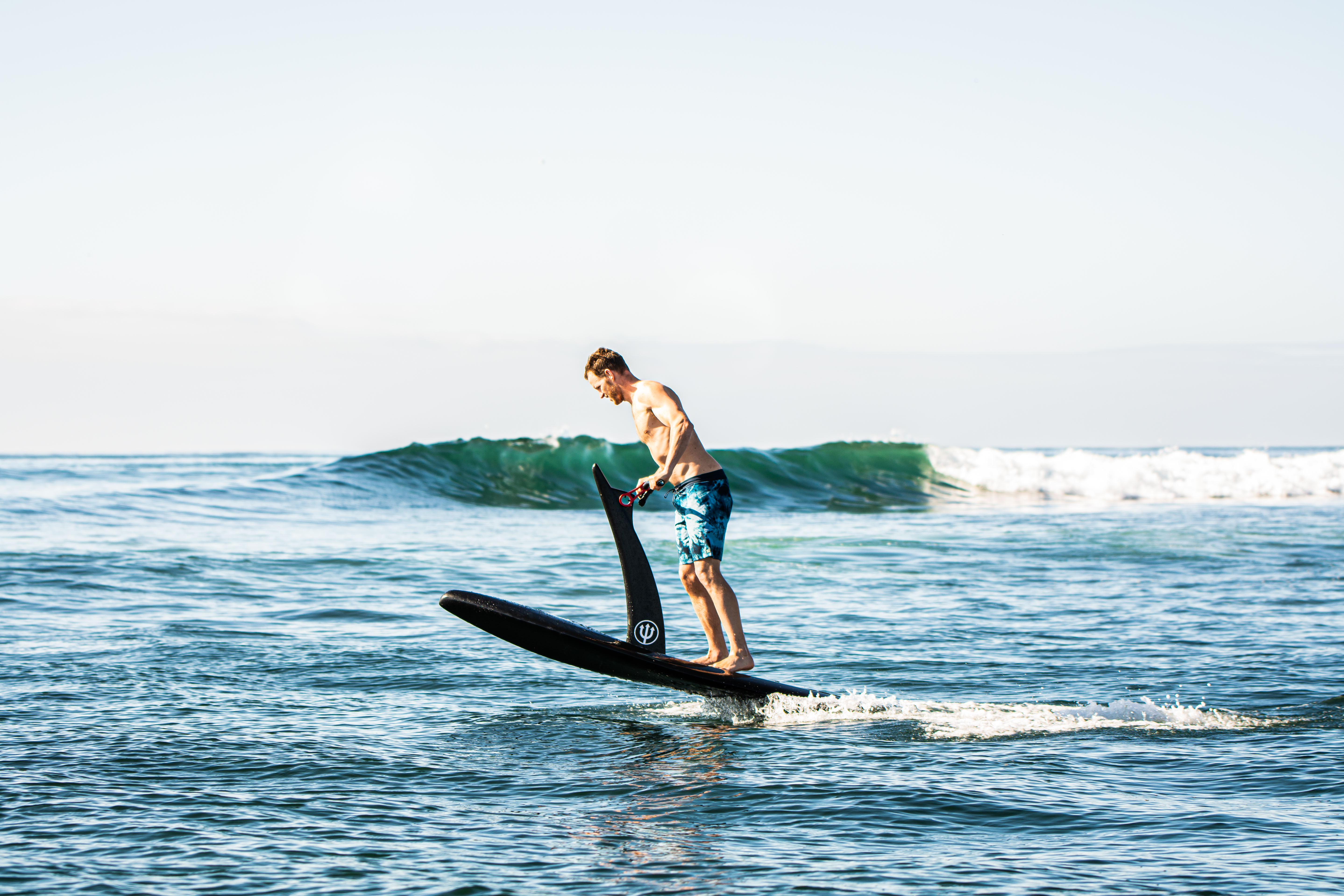 Rider on an eFoil gliding above the ocean in Cabo San Lucas